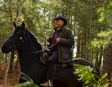 Paul Mihailides on horseback at The Preserve Sporting Club & Residences