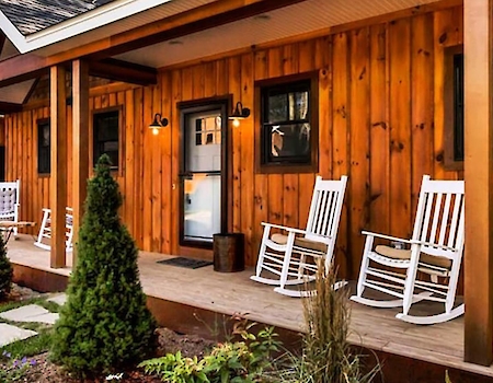 Relax in the comfort of The Preserve Resort & Spa's rustic cabin porch