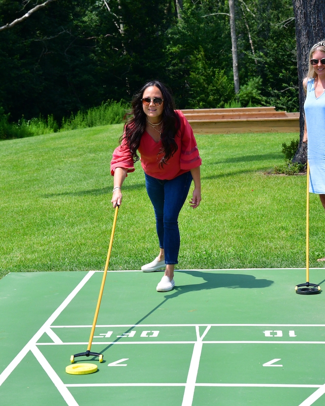 Guests enjoying a lively shuffleboard game at Preserve Resort & Spa.