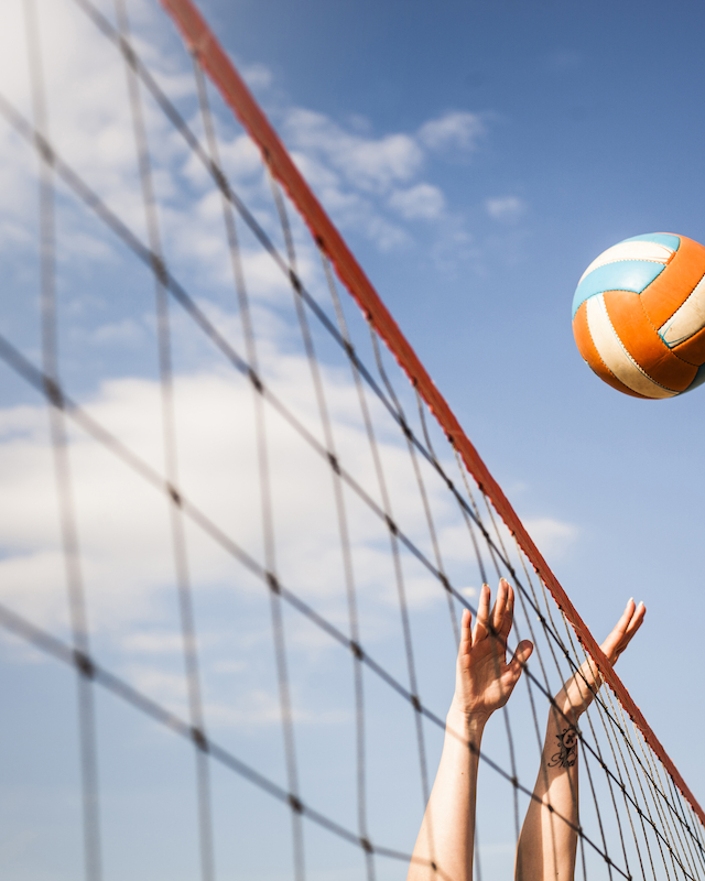 Action-packed beach volleyball game at The Preserve Resort & Spa, showcasing players enjoying the game on our sun-kissed courts.