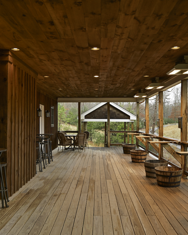 Expansive covered porch offering a serene outdoor event space at Event Venue at The Preserve Resort & Spa in Rhode Island.