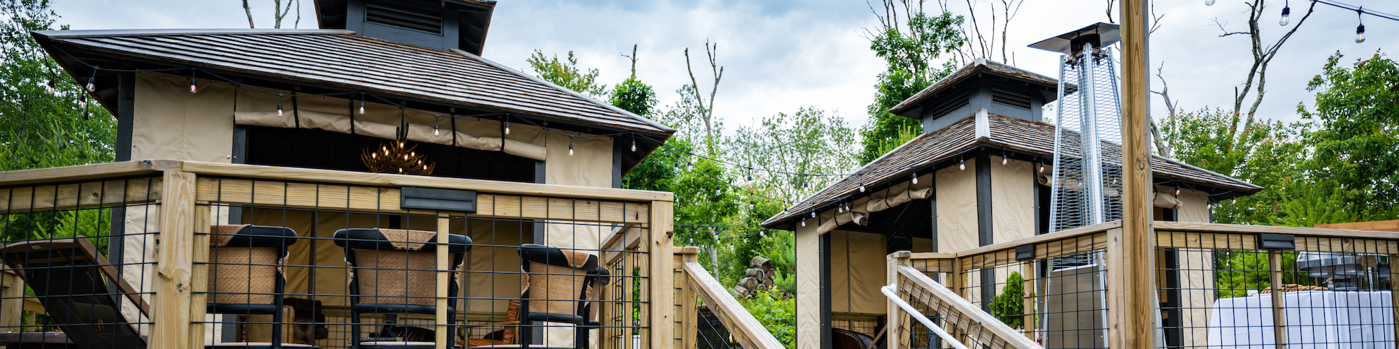 Daytime view of the cozy and luxurious safari tents at Preserve Resort & Spa, ideal for daytime events and nature-connected experiences.