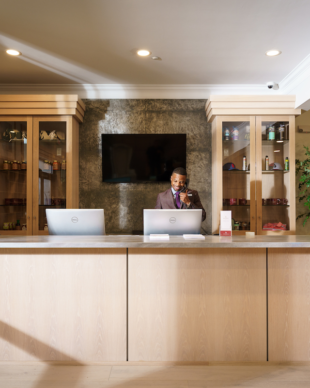 Welcoming reception desk at Hilltop Lounge at Event Venue at The Preserve Resort & Spa in Rhode Island, greeting guests with elegance.